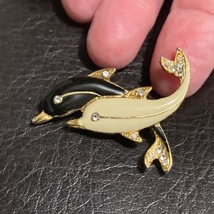 Vintage gold-tone dolphin brooch with rhinestone accents